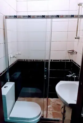 a bathroom with a toilet and a sink at Easeinn in Istanbul