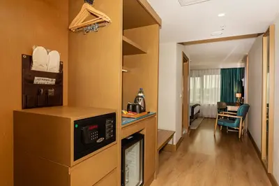a hotel room with a kitchen and a living room at Csk The Halich Port İstanbul in Istanbul