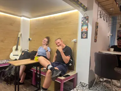 a man and a woman sitting at a table at Rodin Hostel in Istanbul