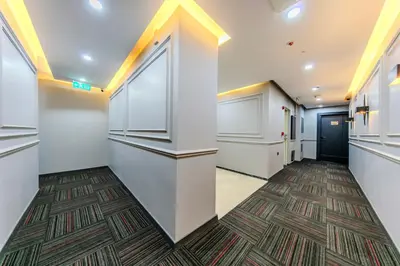 a hallway with white walls and a carpet at Intercity Hotel Istanbul Airport in Arnavutköy