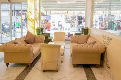 a waiting room with couches and chairs in a store at The Center Hotel in Istanbul