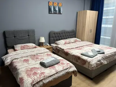 a bedroom with two beds with towels on them at Nur Sena's House in Istanbul