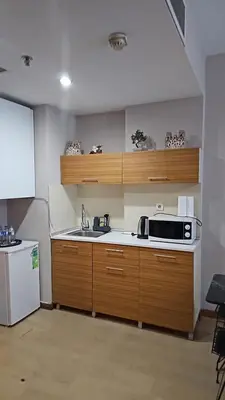 a kitchen with a sink and a microwave at Nur Sena's House in Istanbul