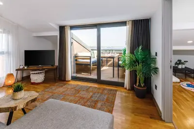 a living room with a large window with a view of the ocean at Monnas Bosphorus in Istanbul