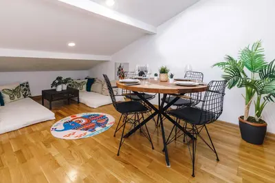 a dining room with a table and chairs in a living room at Monnas Bosphorus in Istanbul
