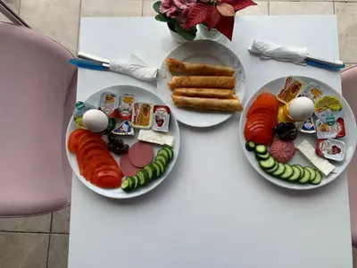 two plates of food on a table with sushi at antik sofia hotel in Istanbul