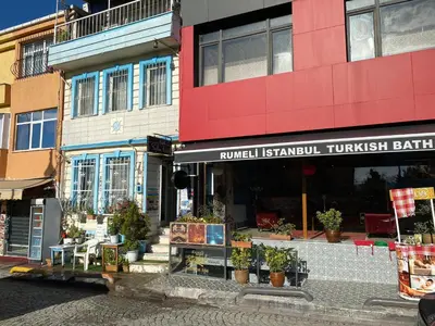 a building with a flower shop on a street at antik sofia hotel in Istanbul