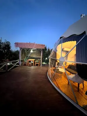 a boat sitting on a dock with a tent at Sapanca Green Dome in Sapanca