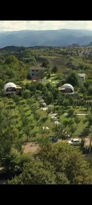 an aerial view of a golf course with buildings and trees at Sapanca Green Dome in Sapanca