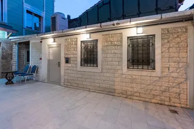 a brick building with a patio with a gate at Valens Boutique Hotel in Istanbul
