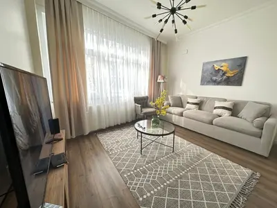 a living room with a couch and a table at Center of city in Beşiktaş 2 plus 1 with 2 Bathroom and 3 Air Conditioner in Istanbul