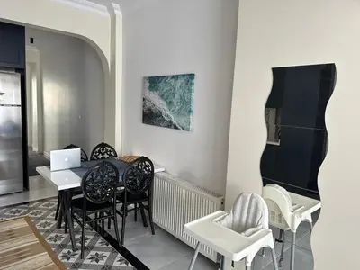 a dining room with a table and chairs at Center of city in Beşiktaş 2 plus 1 with 2 Bathroom and 3 Air Conditioner in Istanbul