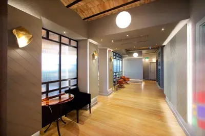 a hallway of a building with a table and chairs at Ayramin Exclusive Hotel - Special Category in Istanbul