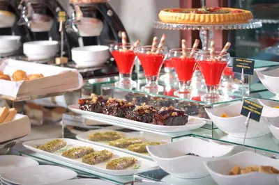 a buffet with different types of desserts and drinks at Ayramin Exclusive Hotel - Special Category in Istanbul