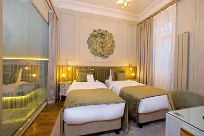a hotel room with two beds and a window at Ayramin Exclusive Hotel - Special Category in Istanbul