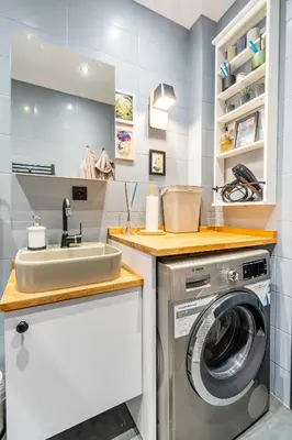a laundry room with a sink and a washing machine at sevim suites Nişantaşı in Istanbul