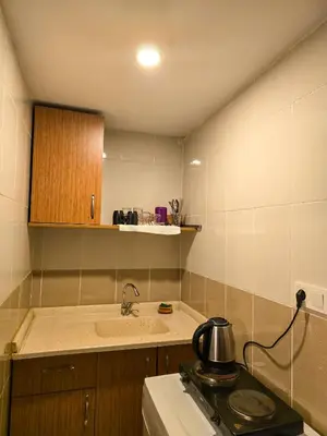 a kitchen with a sink and a tea kettle on a stove at Karakoy Port House in Istanbul