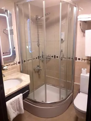 a bathroom with a shower and a sink and a toilet at ZEO HOTEL merter in Istanbul