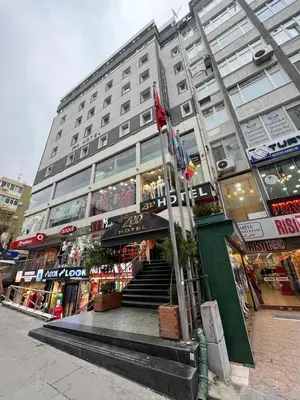 a large building with a staircase in front of it at ZEO HOTEL merter in Istanbul
