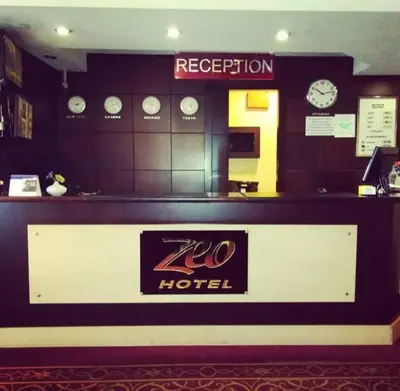 a room with a hotel with clocks on the wall at ZEO HOTEL merter in Istanbul