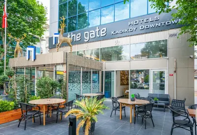 a restaurant with tables and chairs in front of a building at The Gate Kadıköy Downtown in Istanbul