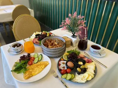 a table with plates of food on a table at The Gate Kadıköy Downtown in Istanbul