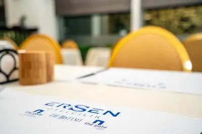 a table with a white table cloth with a sign on it at The Gate Kadıköy Downtown in Istanbul
