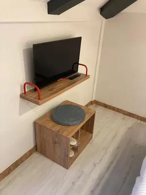 a room with a flat screen tv on a wall at The Gate Kadıköy Downtown in Istanbul