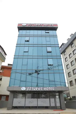 a building with a sign on top of it at ÖZTÜRKS HOTEL in Istanbul