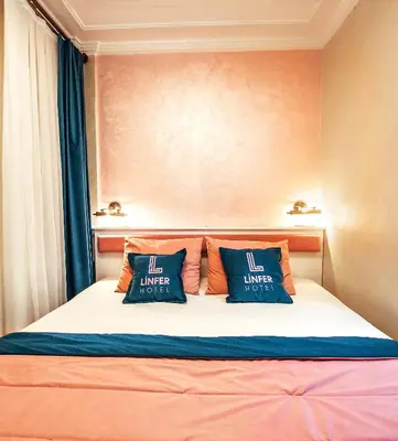 a bedroom with a bed with two pillows on it at Linfer Hotel Taksim in Istanbul