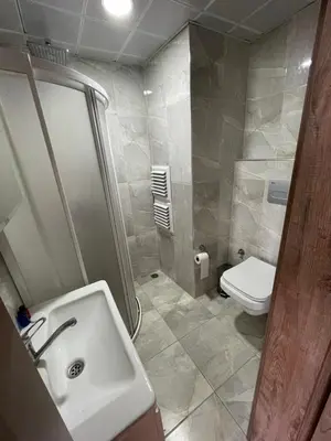 a bathroom with a sink and a toilet at Elegance Aparts Cihangir in Istanbul