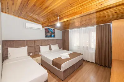 a bedroom with two beds and a window at Terra Apart Taksim in Istanbul