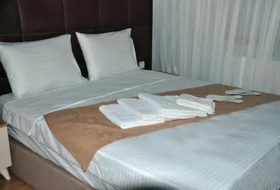 a bed with white towels on top of it at Terra Apart Taksim in Istanbul