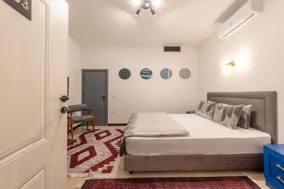 a bedroom with a bed and a chair in it at Hexa Suites Hotel in Istanbul