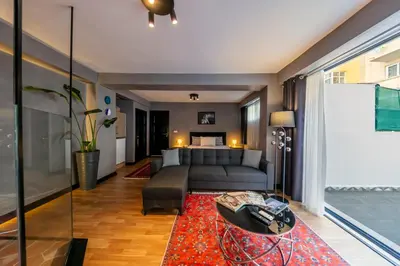 a living room with a couch and a table at Hexa Suites Hotel in Istanbul