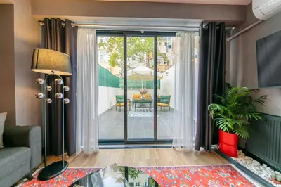 a living room with a couch and a table at Hexa Suites Hotel in Istanbul