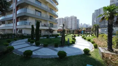 a park in front of a building at Linkinn Luxury Residence & Spa in Esenyurt