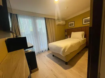 a hotel room with a bed and a window at EA Exclusive Hotel in Istanbul