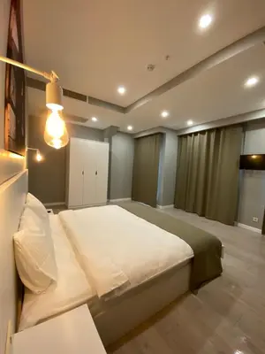 a bedroom with a large bed and a lamp at Li Hotel Pera in Istanbul