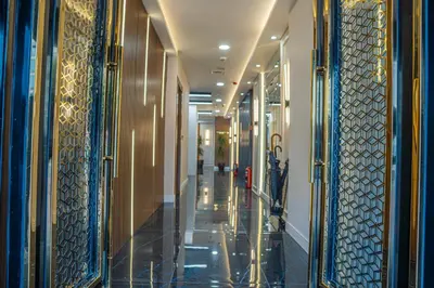 a hallway of a building with blue and gold walls at Istanbul Midpoint Hotel in Istanbul