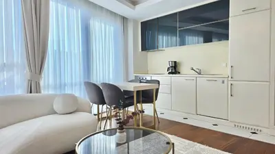 a living room with a couch and a table at Elysium Soul Residence in Istanbul