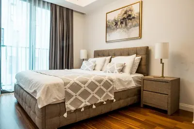 a bedroom with a large bed and a window at Elysium Soul Residence in Istanbul
