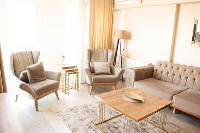 a living room with a couch and two chairs and a table at Deluxe King Suite AS3 in Esenyurt
