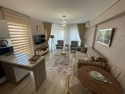 a living room with a couch and a table at Deluxe King Suite AS3 in Esenyurt