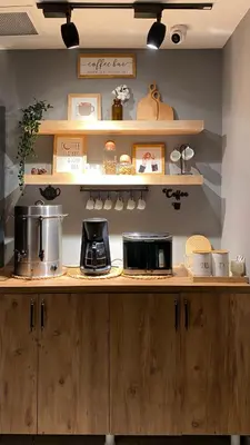 a kitchen with wooden cabinets and a counter top at BRANDROOM HOTEL in Istanbul