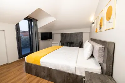 a bedroom with a large bed and a window at BRANDROOM HOTEL in Istanbul