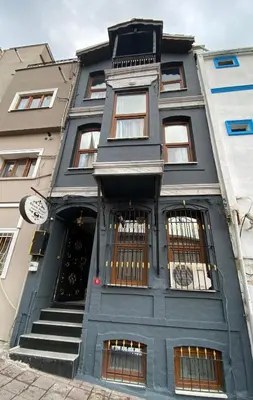 a blue building with a staircase in front of it at Sultanahmet Black Pearl Apart Hotel in Istanbul