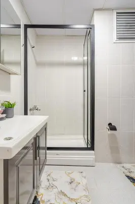 a bathroom with a shower and a sink at Deluxe King Suite MAI21 in Esenyurt