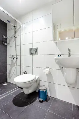 a bathroom with a toilet and a sink at Aram Kerasi Rooms in Istanbul
