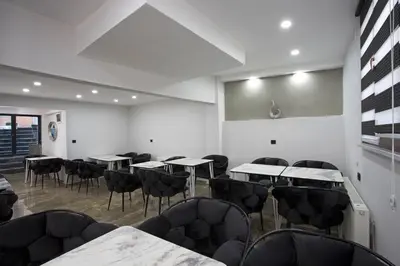 a room with tables and chairs in a building at Carvan hotel in Istanbul